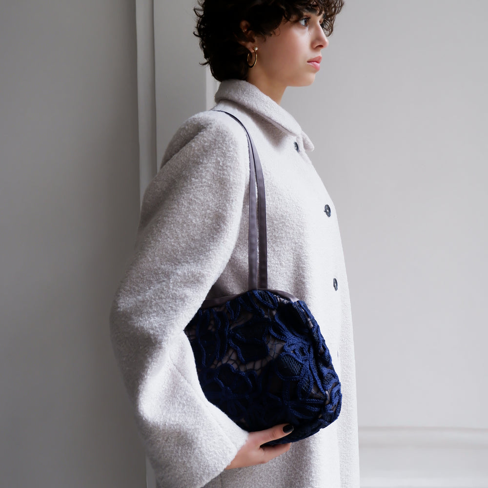 
                      
                        EMBROIDERED NAVY BAG
                      
                    