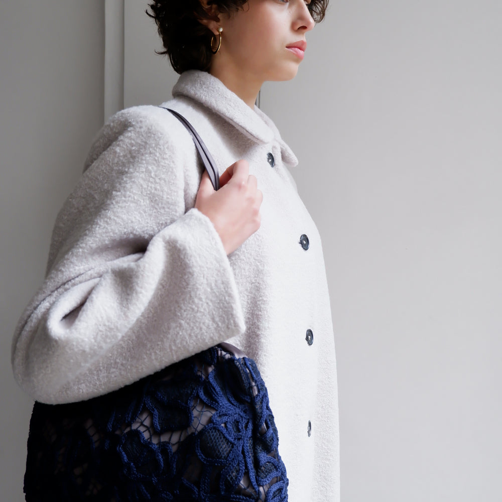 
                      
                        EMBROIDERED NAVY BAG
                      
                    