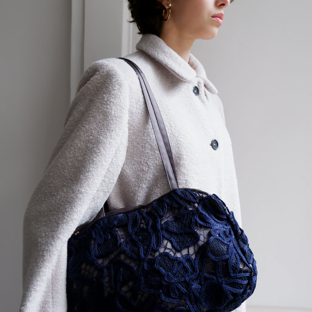 
                      
                        EMBROIDERED NAVY BAG
                      
                    