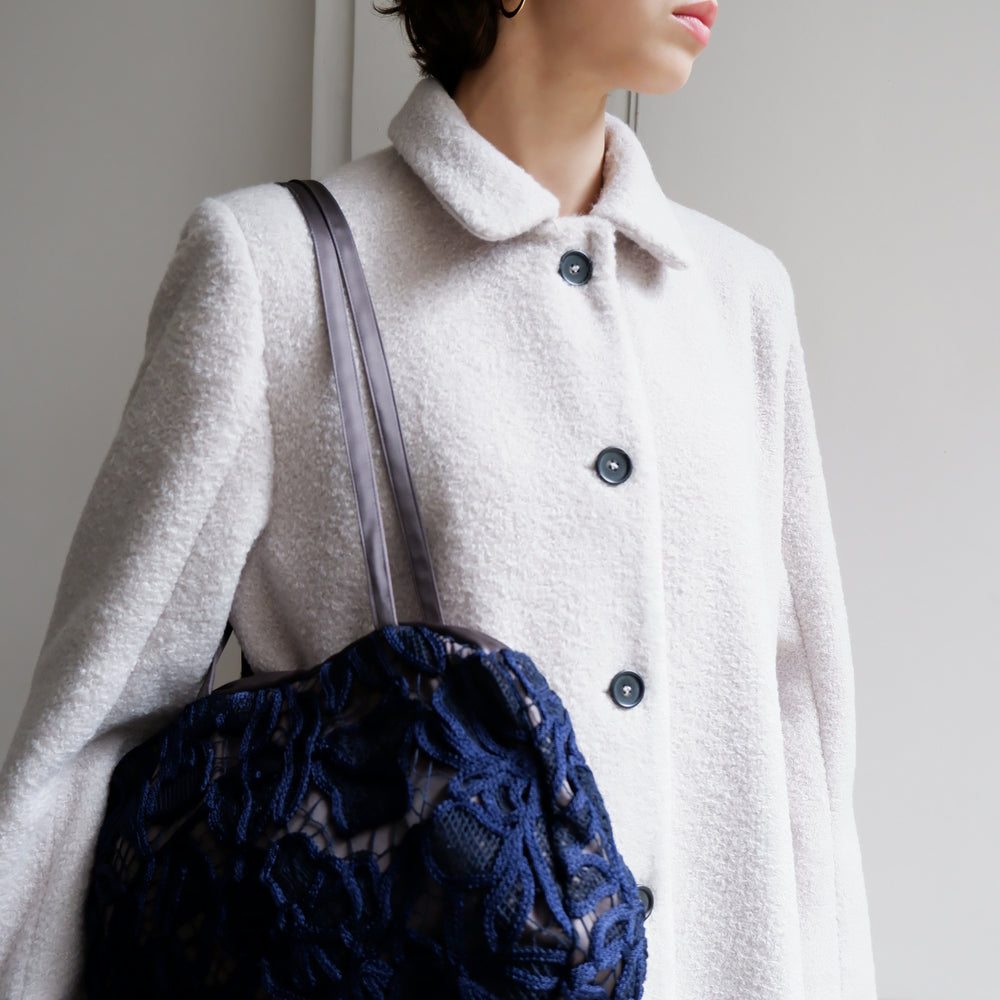 
                      
                        EMBROIDERED NAVY BAG
                      
                    