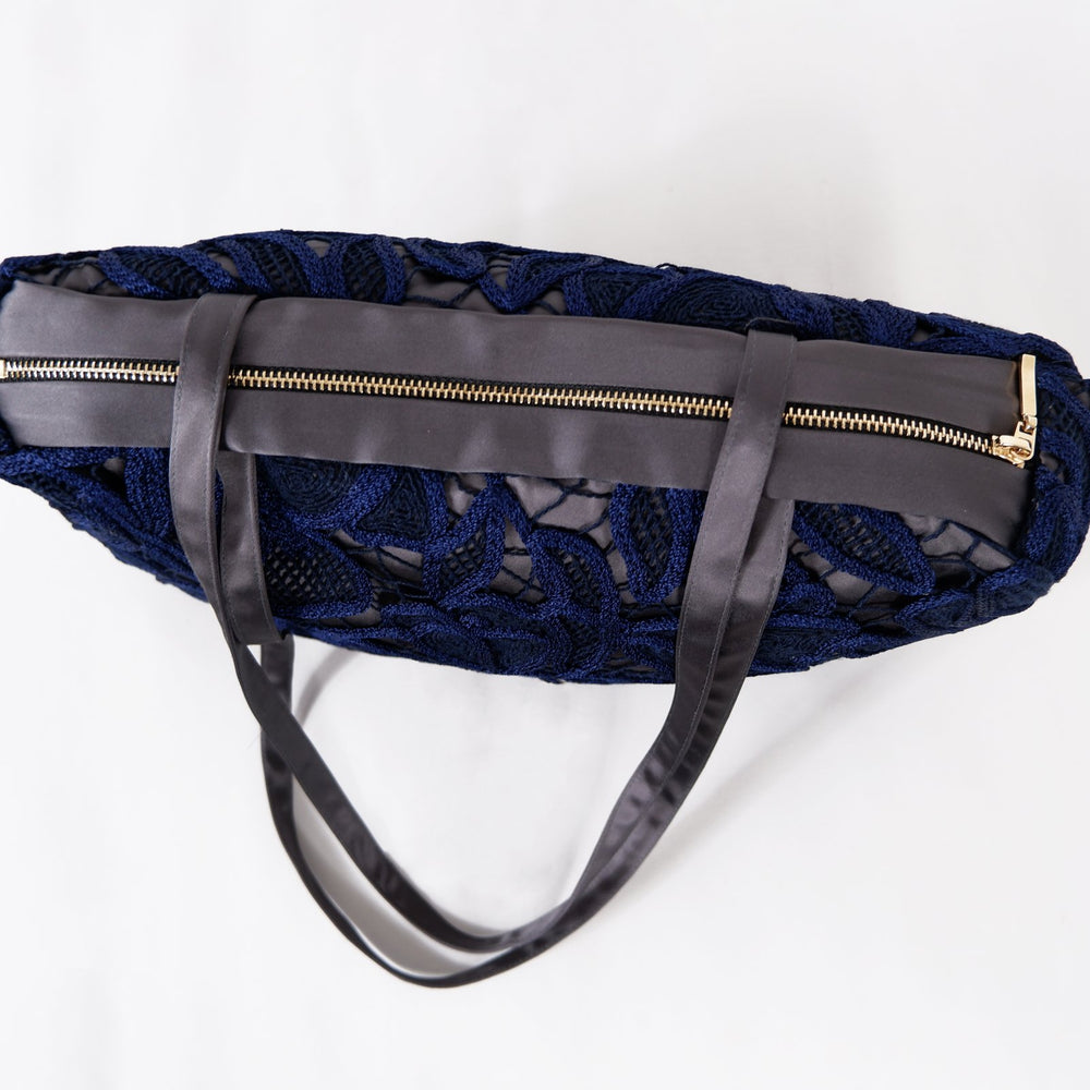 
                      
                        EMBROIDERED NAVY BAG
                      
                    