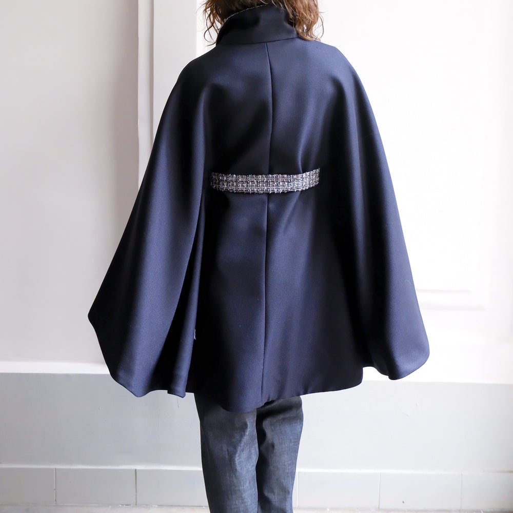 
                      
                        ANGELE NAVY TWEED CAPE
                      
                    